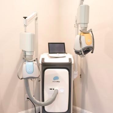 The BrainsWay Deep TMS (Transcranial Magnetic Stimulation) system, featuring the patented H-coil helmet for non-invasive treatment of various brain disorders