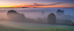 Sun burning through a thick fog, symbolizing the restoration of mental clarity and balance