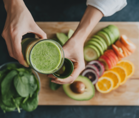 Hands preparing a colorful, healthy meal, representing the nourishing approach to wellness at VASAV Health