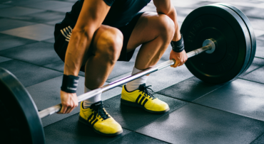 A close-up on proper foot positioning for strength training, representing a focus on technique
